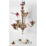 A 20th century Murano glass three branch chandelier, with floral inserts,