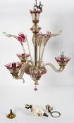 A 20th century Murano glass three branch chandelier, with floral inserts,