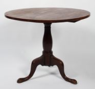 A Georgian mahogany circular occasional table, on tripod base,