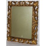 A 19th century carved gilt mirror, with scrolling pierced acanthus frame,