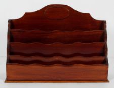 An Edwardian mahogany stationery rack,