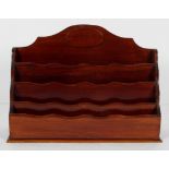 An Edwardian mahogany stationery rack,