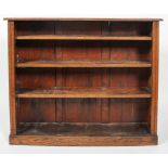 A late 19th century oak bookcase with three adjustable shelves,