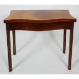 A George III mahogany and line inlaid serpentine fold out card table, with moulded legs,