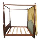 A Georgian style four poster bed, probably walnut,