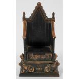 A Queen Elizabeth Coronation throne and metal money box,