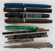 A collection of pens, including Parker Duofold, Triumph,
