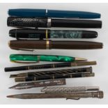 A collection of pens, including Parker Duofold, Triumph,