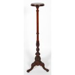 A Victorian style mahogany torchere stand, the circular tray on a carved column and tripod base,