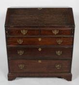 A George III oak bureau, the fitted interior above two short and three graduated long drawers,