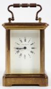 A miniature French brass carriage timepiece, the dial inscribed London Clock Co, with key,