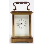 A miniature French brass carriage timepiece, the dial inscribed London Clock Co, with key,