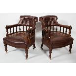 A pair of Victorian leather upholstered tub armchairs, with button stud decoration to back,