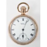 A gold plated open face Waltham pocket watch. Circular white dial with roman numerals.