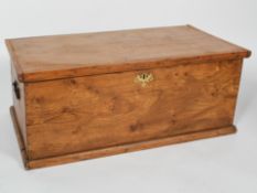 An Elm trunk, with twin handles and vacant interior,