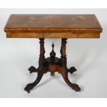 A 19th century Walnut card table with inlaid decoration, twist top mechanism,