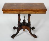 A 19th century Walnut card table with inlaid decoration, twist top mechanism,