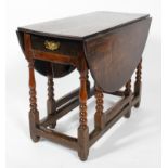 An 18th century oak gate leg dining table,