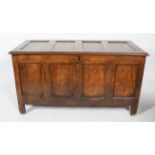 An 18th century coffer, of panelled construction, the top and front with four recessed panels,