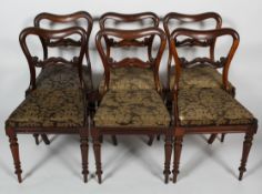 A set of six Victorian rosewood balloon back dining chairs,