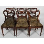 A set of six Victorian rosewood balloon back dining chairs,