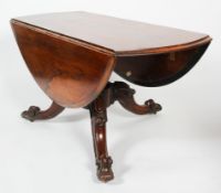 A Victorian rosewood drop leaf dining table, the top with a moulded rim,