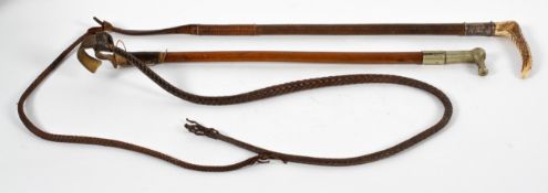 Two vintage hunting whips, comprising : a Swan silver mounted carved horn handled leather whip,