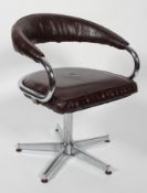 A 1970's vintage swivel desk chair, with tubular chromed frame and faux leather upholstery,