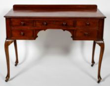 A Victorian mahogany dressing table, with an arrangement of five drawers, on cabriole legs,