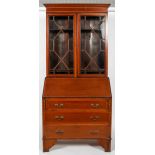 An Edwardian satinwood and inlaid bureau bookcase,