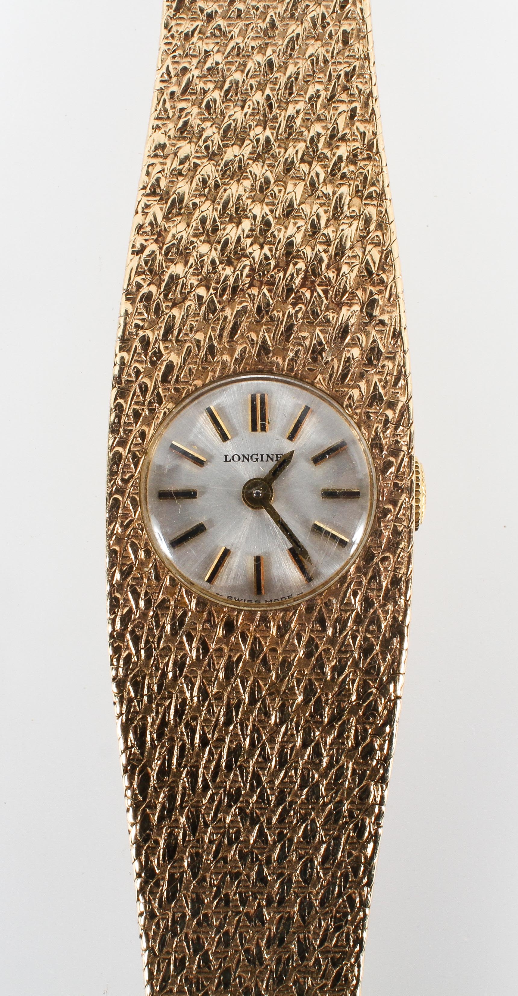 A yellow gold Longines wristwatch. Mechanical movement; signed longines.