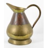 A copper and brass hay stack style measuring jug,