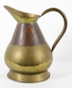 A copper and brass hay stack style measuring jug,