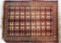 An Afghan rug, the wavy field with columns of stepped guls enclosed by narrow borders,