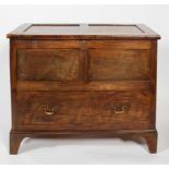 A Welsh coffer, of panelled construction with lower deep drawer and brass handles, on bracket feet,