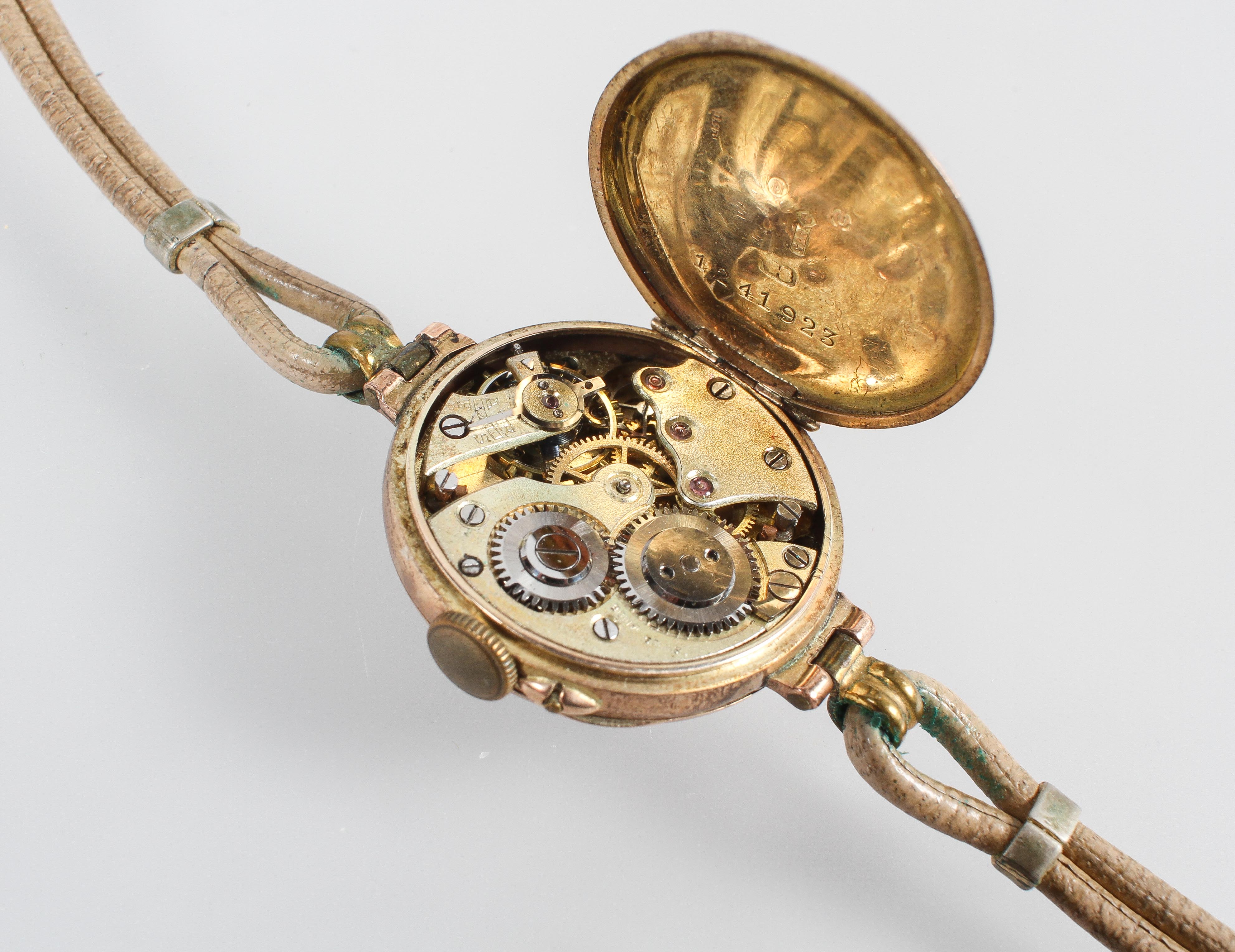 A rose metal wristwatch. Circular white dial with numerical markings. Mechanical movement. - Image 2 of 2