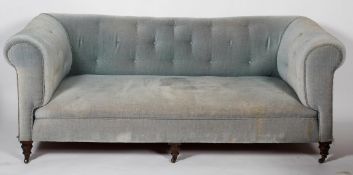 A Victorian Chesterfield sofa, with buttoned blue velvet upholstery and turned front legs,