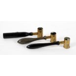 A set of three late 19th century brass and turned wood gun powder shot measures,