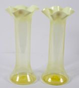 A pair of Victorian vaseline cylindrical vases, circa 1900, with opaque flared petal shaped rims,