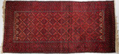 A Baluch rug, the diamond lattice field enclosed by multiple borders,