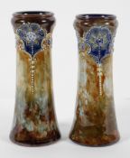 A pair of Royal Doulton stoneware vases, of waisted form, with slip trailed floral decoration,