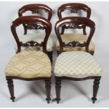 Four Victorian style mahogany balloon back dining chairs,