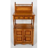 A Victorian satin pine washstand, with gallery back, two drawers and panelled cupboard,