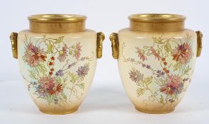 A pair of Royal Bonn bush ivory vases, with enamelled and gilt floral decoration,