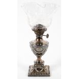 A Victorian silver urn shaped oil lamp and engraved glass lamp, late 19th century,