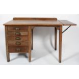 An oak desk, with five small drawers, extending leaf to the right hand side,
