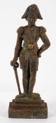 A Victorian cast iron door stop, in the form of a soldier in a bi-corn hat,