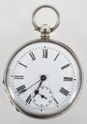 An open face pocket watch with white circular dial and Roman numerals.