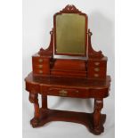 A mahogany Duchess style dressing table, with an arched mirror,