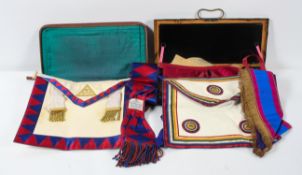 A collection of Masonic regalia, mainly aprons and sashes,